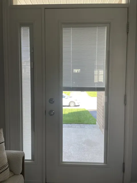Front door with blinds between the glass raised halfway, Ottawa