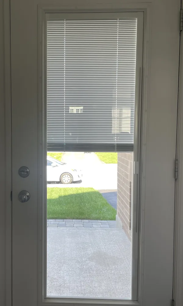 Blinds between the glass raised halfway