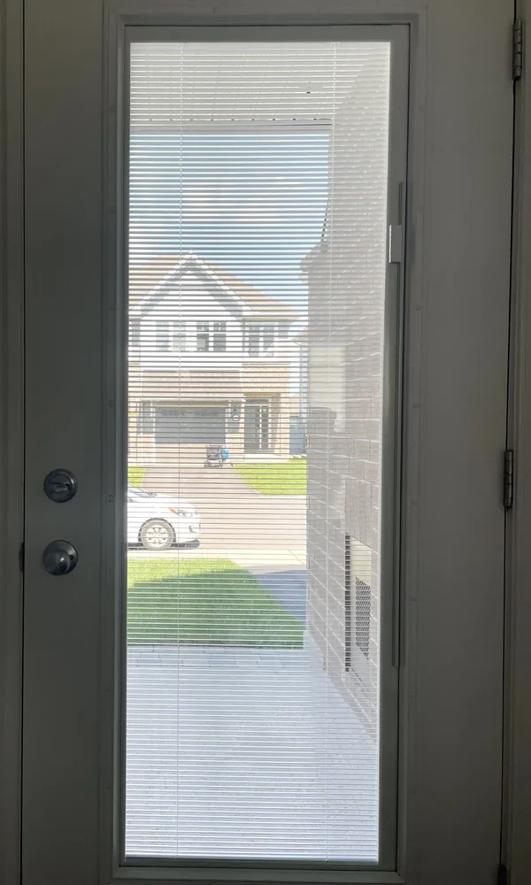 Blinds between the glass tilted open, clear view out