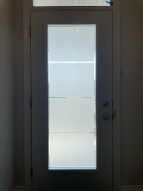 Sandblasted 5 panel glass in a front door, part of the glass itself