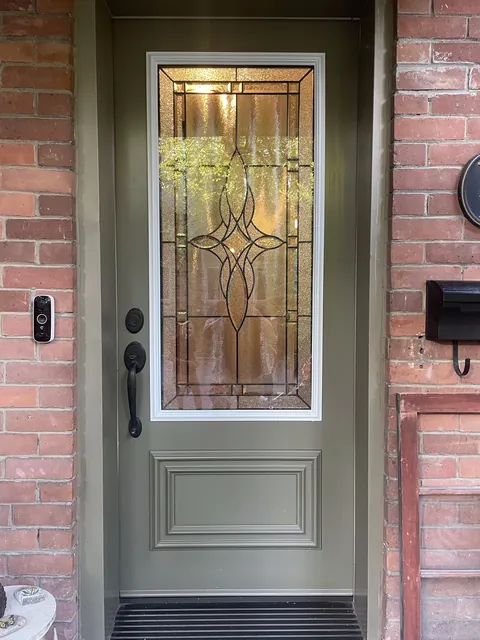 After: the same door with a new opening cut and a decorative glass insert