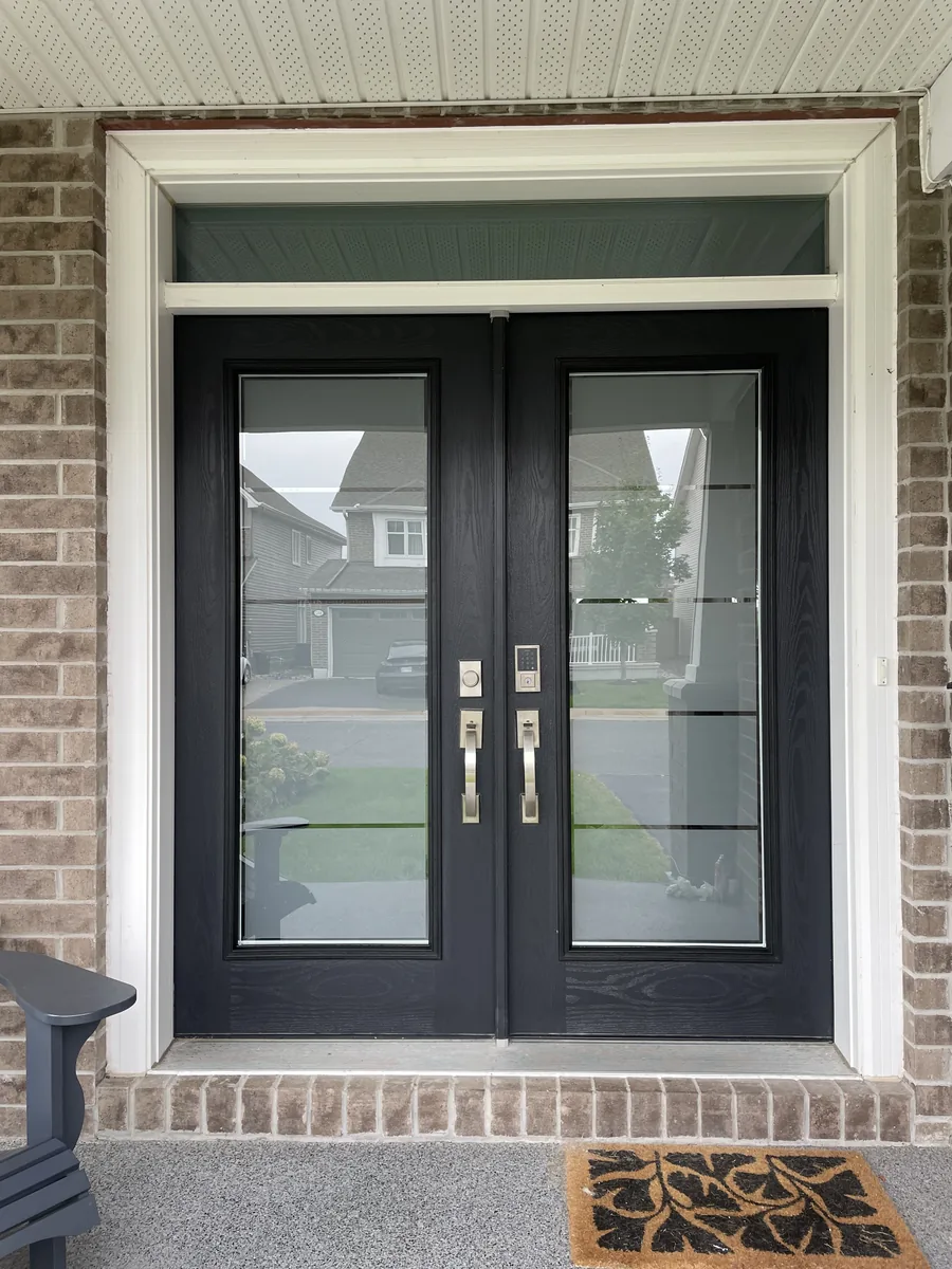 Black double doors after sandblasted privacy glass, Ottawa