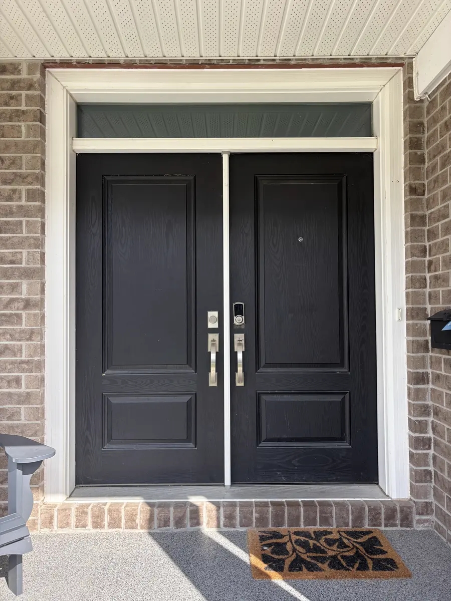 Solid black double doors with no glass before, Ottawa